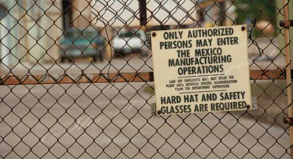 Sign at closed brick manufacturing facility in a small town, Small town USA