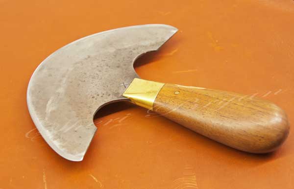 Leatherworking tool Roundhead knife on a piece of leather