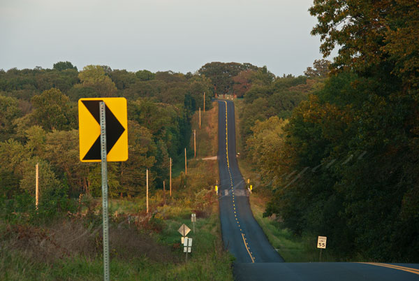 Route F blacktop road near Rucker Missouri  Blacktop highway going up and down hill Sunset lighting