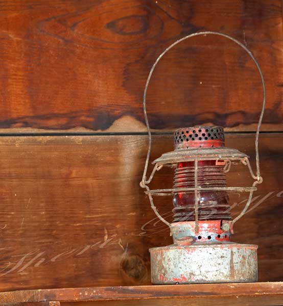 Collectable, antique, vintage metal lantern with red glass globe