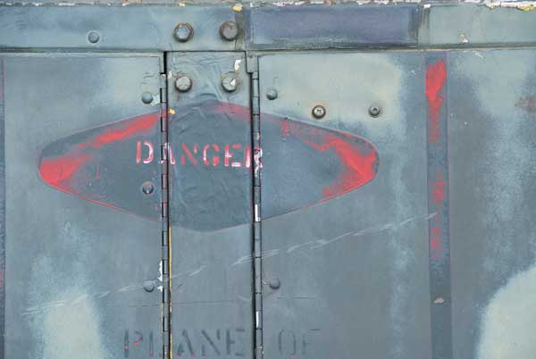 Danger sign printed on a gas turbine engine generator