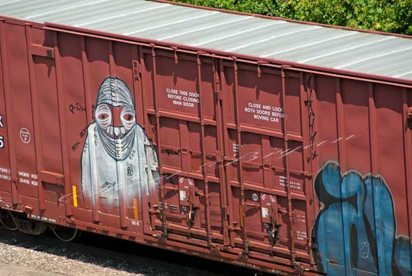 Freight train car with graffiti.  ROH graffiti.  Gang graffiti.  Train box car.