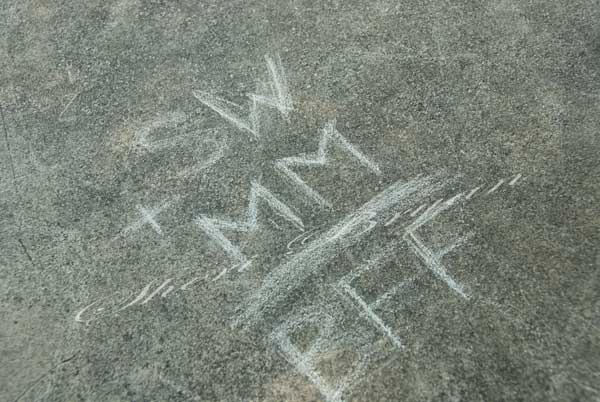 Graffiti written in chalk on concrete  BFF Best friends forever
