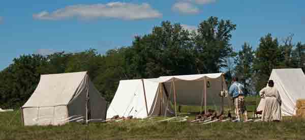 Civil War reenactment with reenactors at the Centralia  Battlefield In Boone County Missouri.  Civil War era costumes and props, White tent